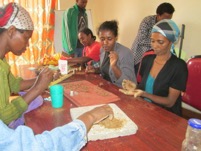In the workshop, the powder is mixed with water and rolled to create the beads