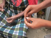Here the beads are being strung 
