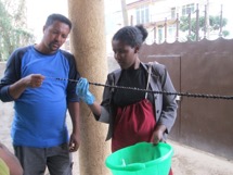 And hung to dry – Aregahegn Assefa helps one of our ladies hang the beads to dry