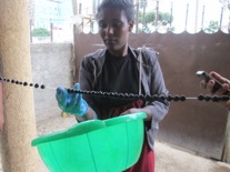 And hung to dry – Aregahegn Assefa helps one of our ladies hang the beads to dry